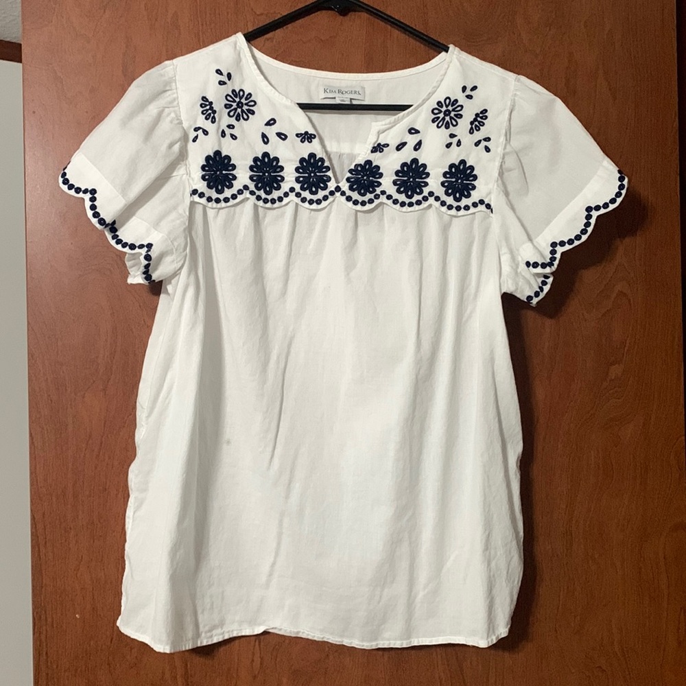 White blouse with navy blue embroidery
